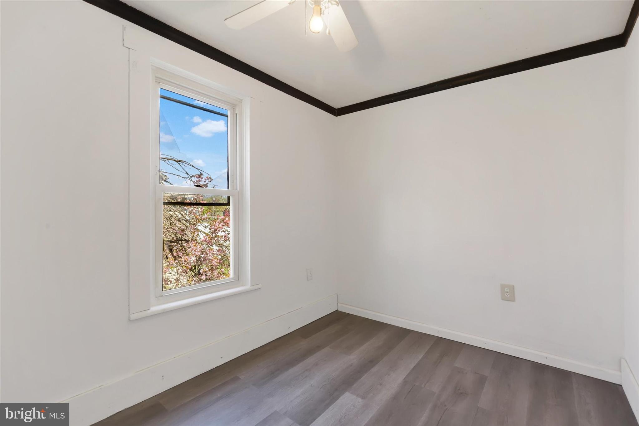 1435 Orchard Road Mifflinburg, PA 17844 - Photo 8 of 16 a view of an empty room with wooden floor and a window