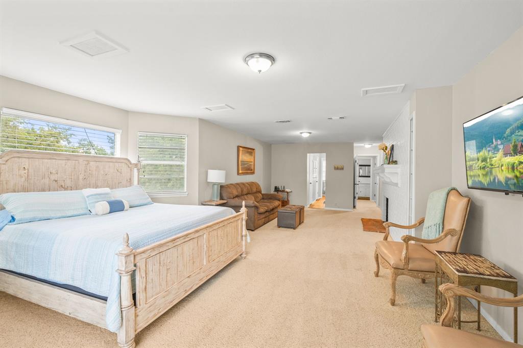 664 Lake Point Loop Pottsboro, TX 75076 - Photo 14 of 40 a bed room with a bed and large window