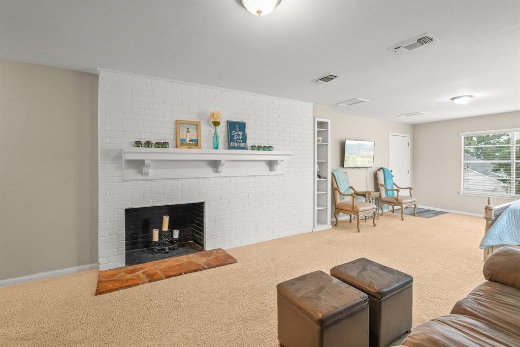 664 Lake Point Loop Pottsboro, TX 75076 - Photo 16 of 40 a living room with furniture and a fireplace