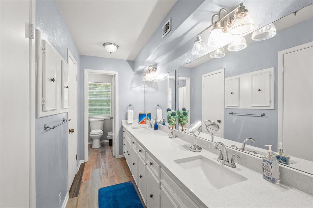 664 Lake Point Loop Pottsboro, TX 75076 - Photo 17 of 40 a bathroom with a double vanity sink mirror and