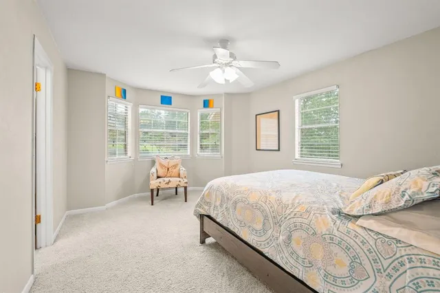 a bedroom with a bed and window