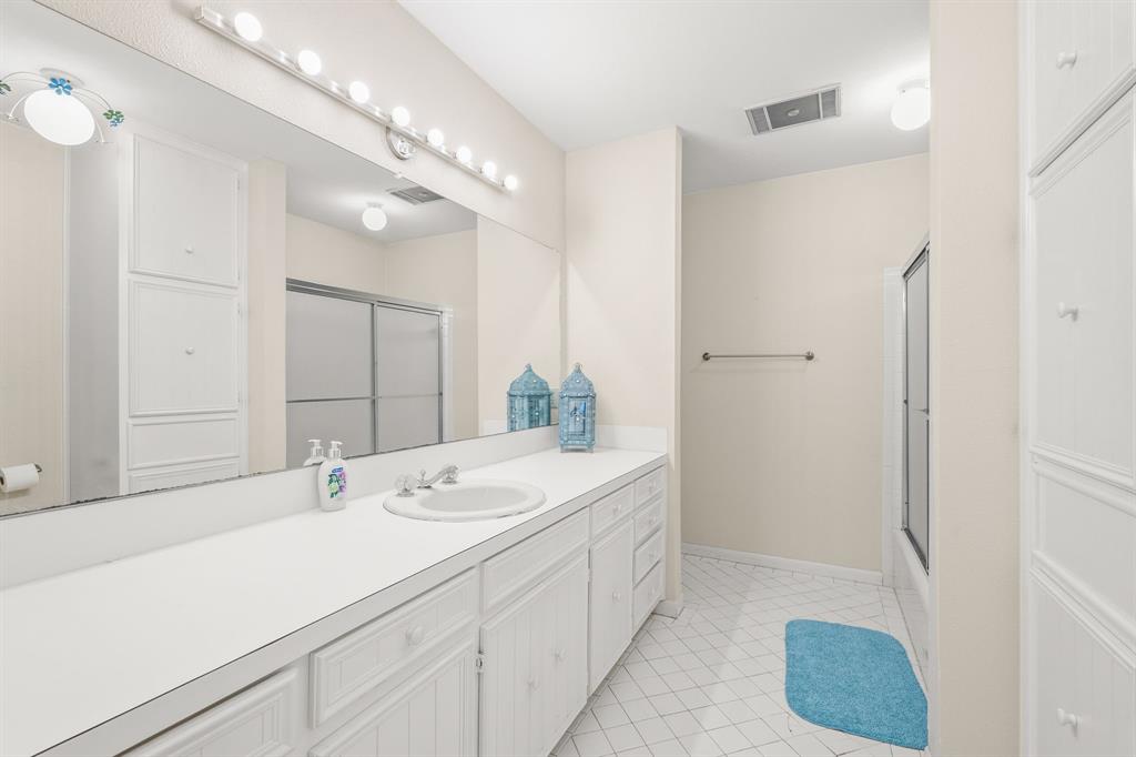 664 Lake Point Loop Pottsboro, TX 75076 - Photo 23 of 40 a spacious bathroom with a sink a mirror and a shower