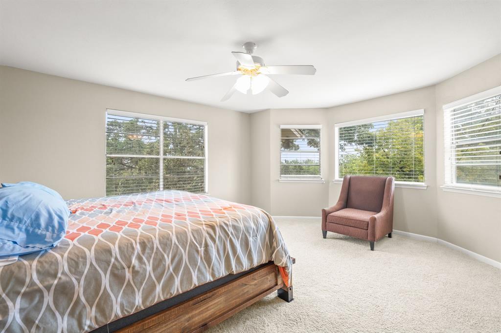 664 Lake Point Loop Pottsboro, TX 75076 - Photo 24 of 40 a bedroom with a bed chair and window