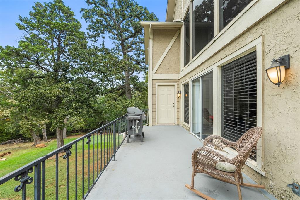 664 Lake Point Loop Pottsboro, TX 75076 - Photo 34 of 40 a view of a chair and tables in the balcony