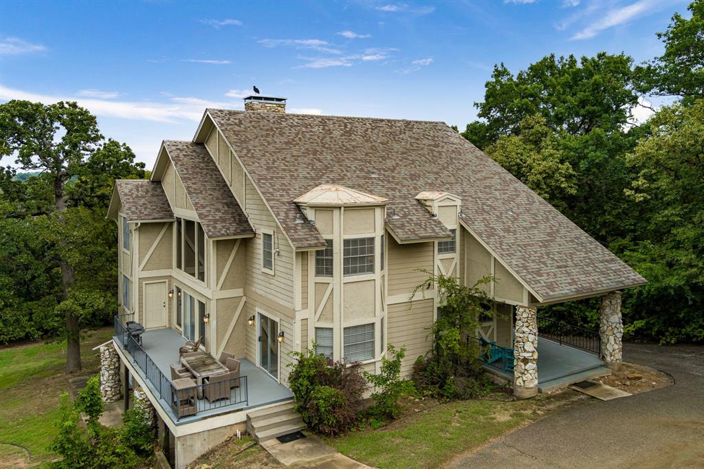 664 Lake Point Loop Pottsboro, TX 75076 - Photo 4 of 40 an aerial view of a house with a yard