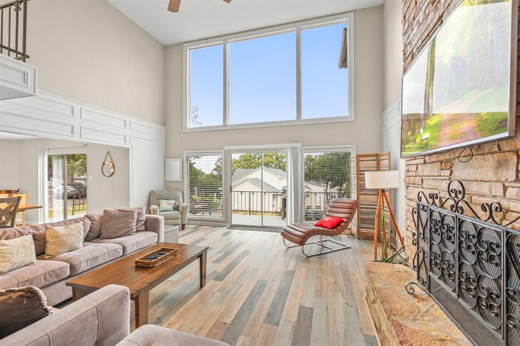 664 Lake Point Loop Pottsboro, TX 75076 - Photo 6 of 40 a living room filled with furniture and floor to ceiling windows