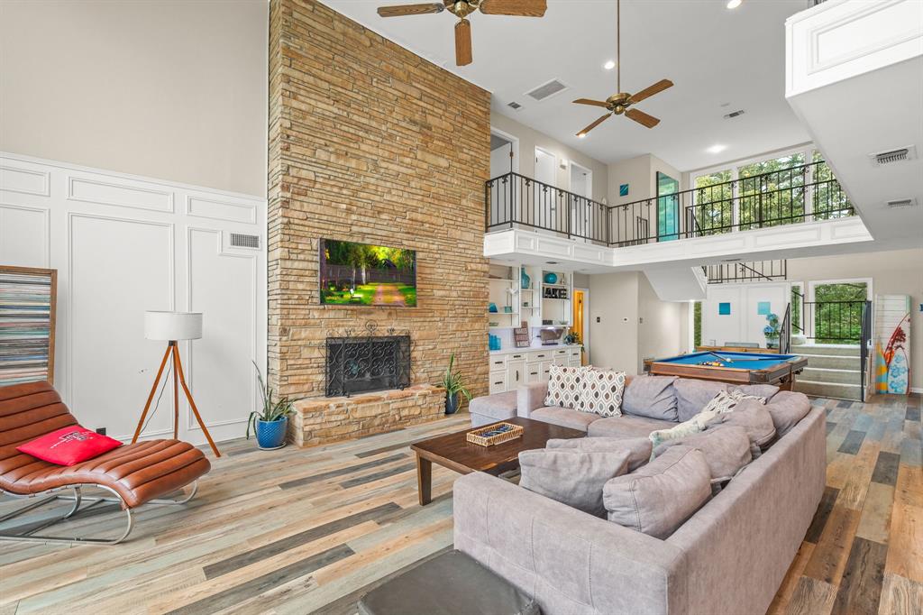 664 Lake Point Loop Pottsboro, TX 75076 - Photo 7 of 40 a living room with patio furniture and a fireplace