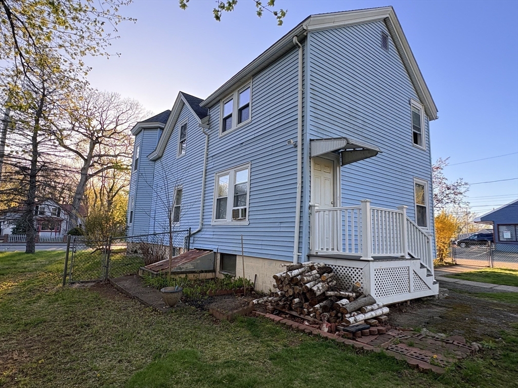 980 Washington Street, Unit 2 Stoughton, MA 02072 - Photo 9 of 10 a view of backyard of house