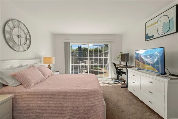 a bedroom with a bed and furniture