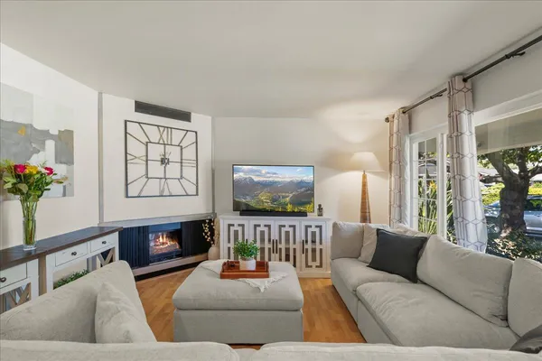 a living room with furniture and a flat screen tv