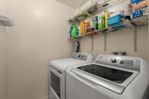 a utility room with dryer and washer