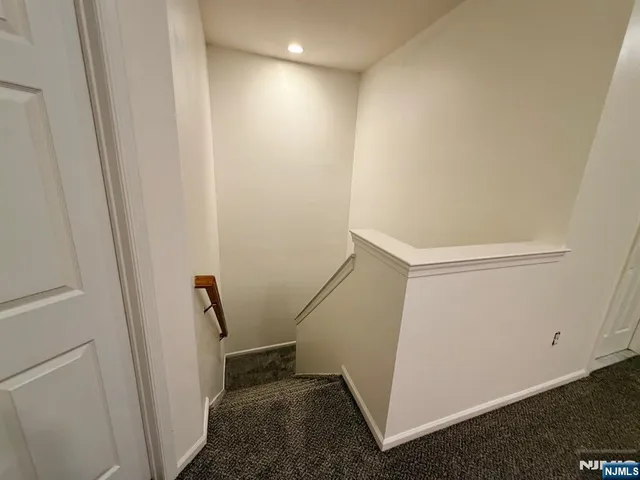a bathroom with a granite countertop sink a toilet and shower
