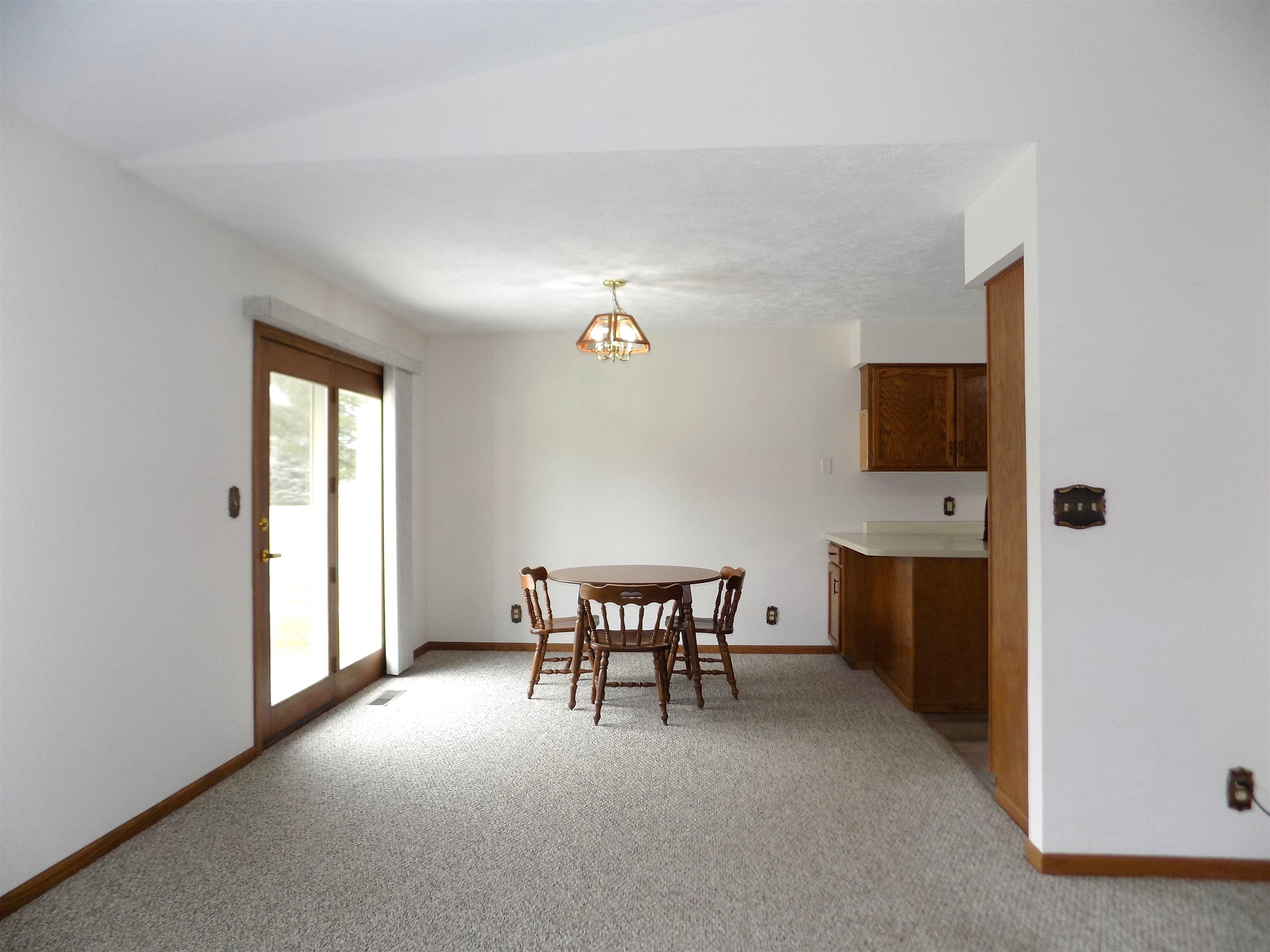 4252 Waltham Road Roscoe, IL 61073 - Photo 15 of 31 a view of a livingroom with furniture and a flat screen tv