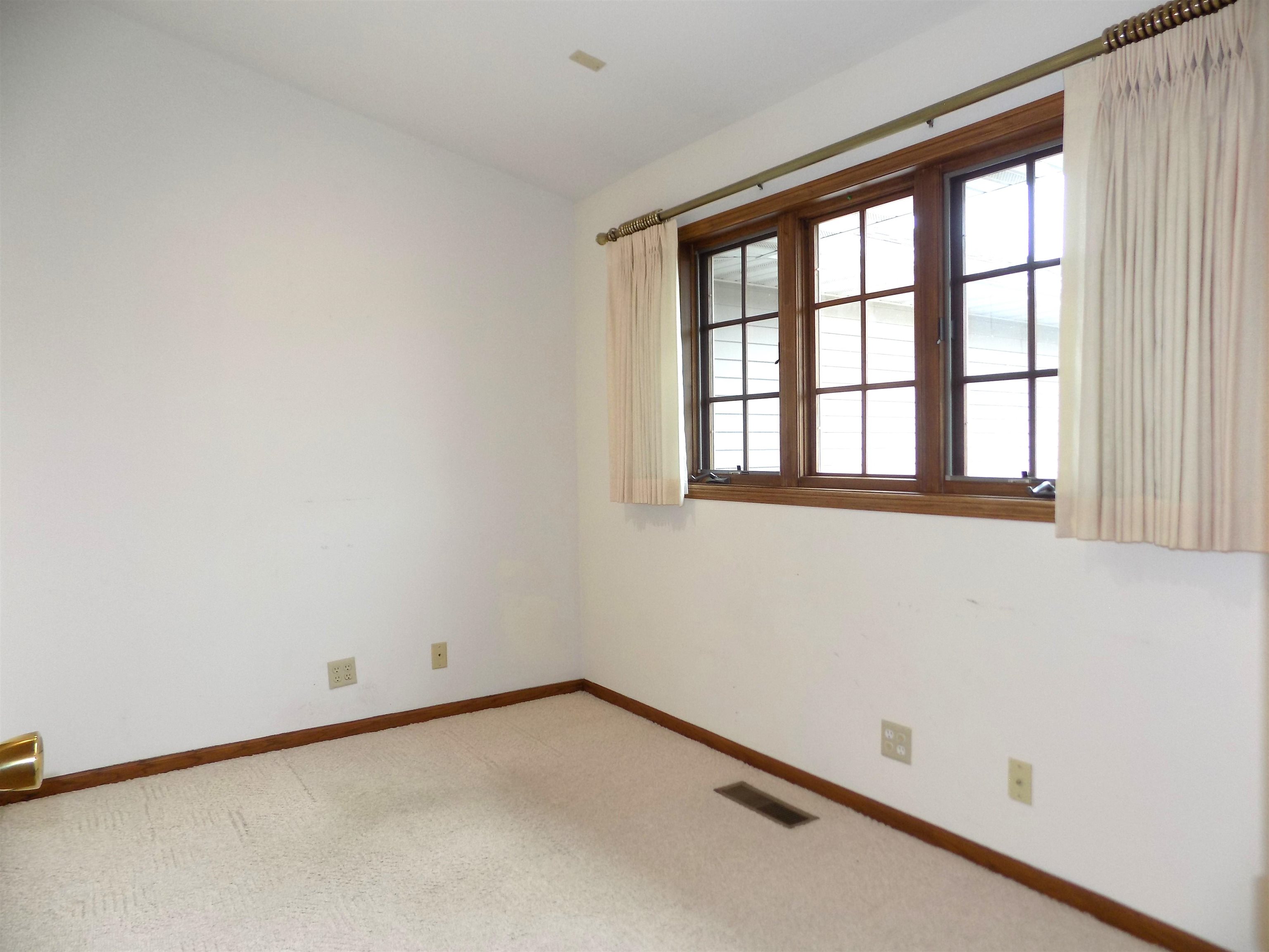 4252 Waltham Road Roscoe, IL 61073 - Photo 17 of 31 an empty room with a window