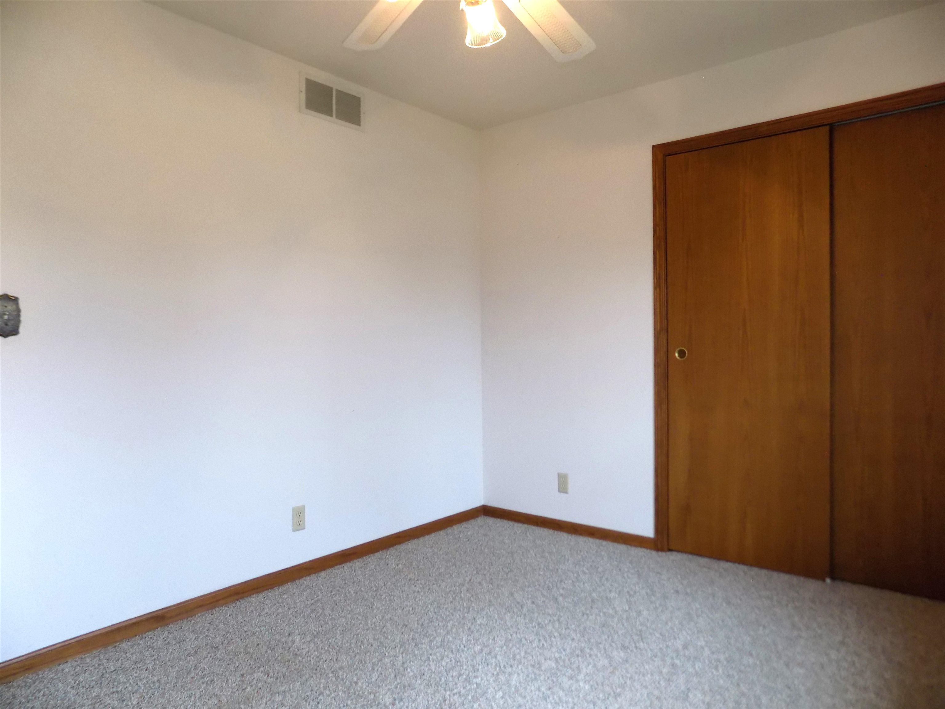 4252 Waltham Road Roscoe, IL 61073 - Photo 19 of 31 an empty room with an entryway and fan