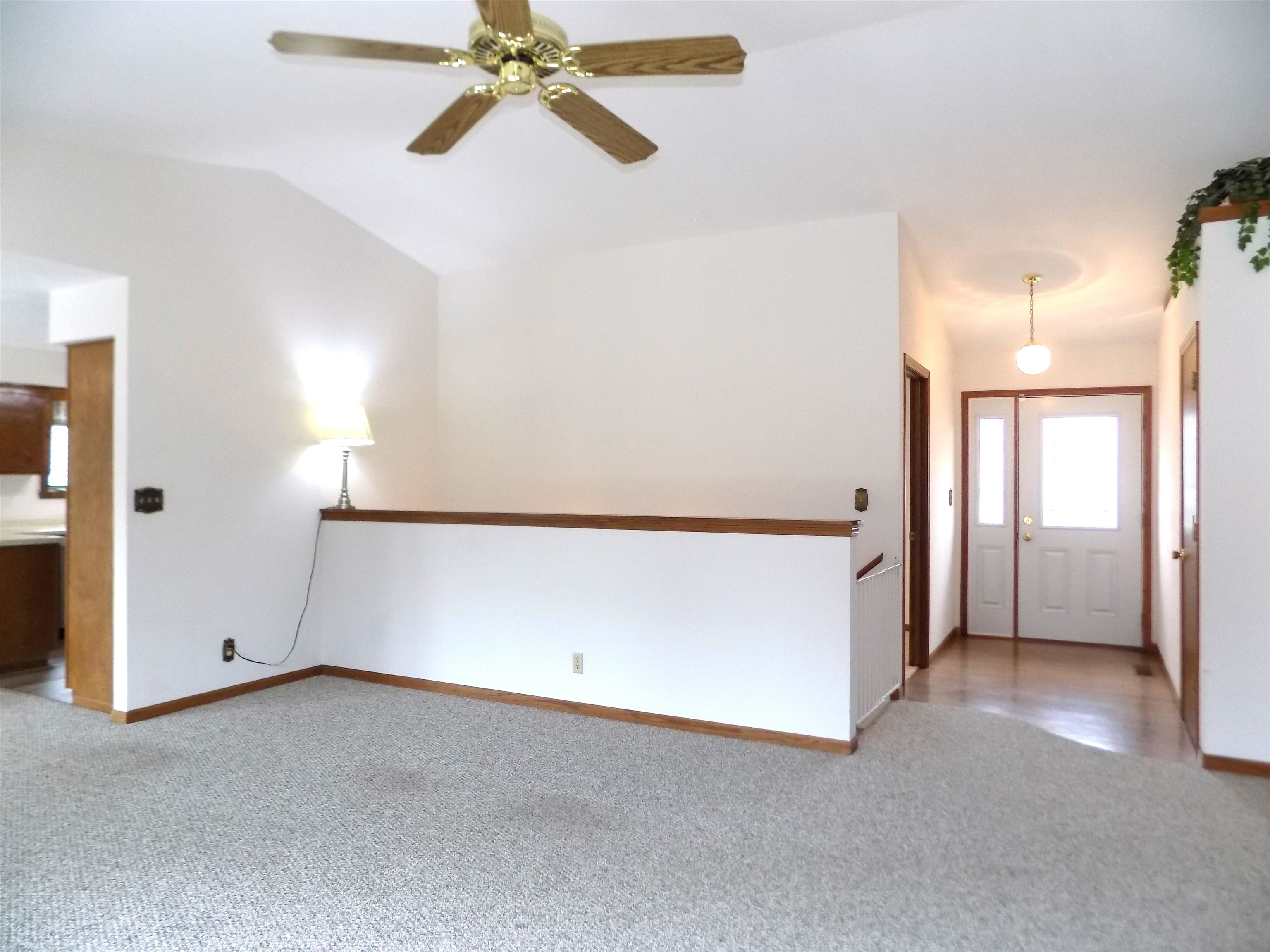 4252 Waltham Road Roscoe, IL 61073 - Photo 6 of 31 a view of a room with window and a ceiling fan