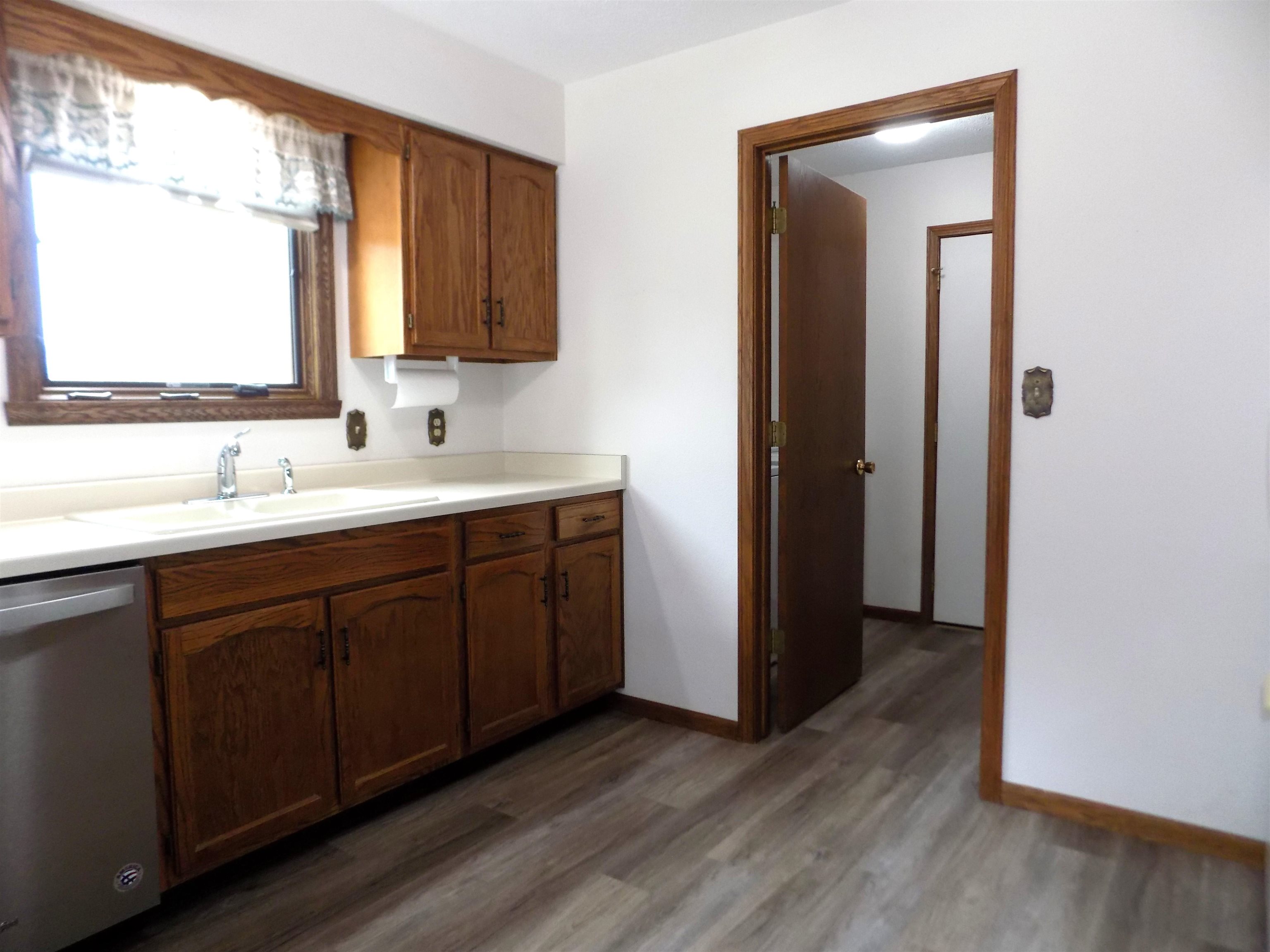 4252 Waltham Road Roscoe, IL 61073 - Photo 10 of 31 a bathroom with a double vanity sink a mirror and a window