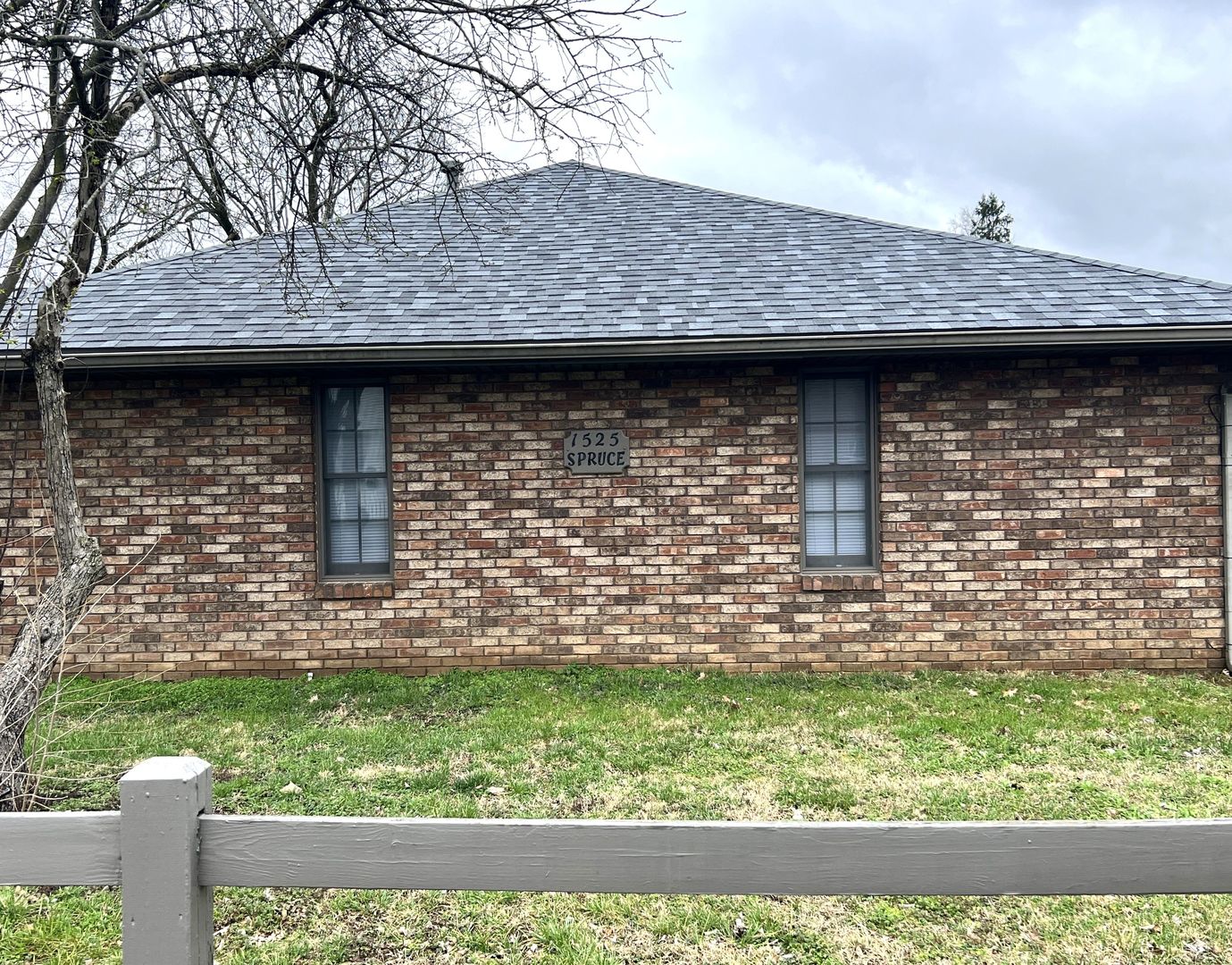 1525 Spruce Street Murphysboro, IL 62966 - Photo 4 of 13 a stone house with a garden view