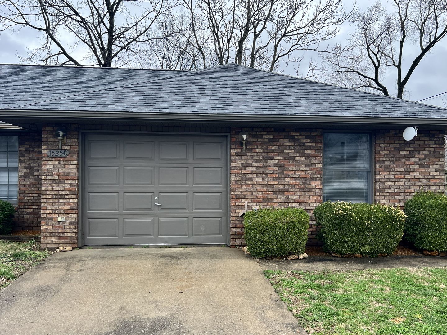 1525 Spruce Street Murphysboro, IL 62966 - Photo 7 of 13 a front view of a stone house with a garage