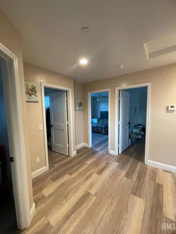 a view of a livingroom with a hall and a bathroom