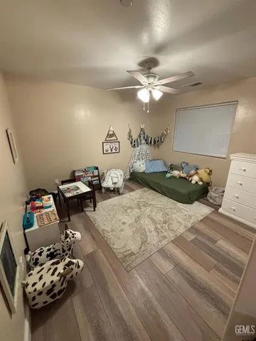 a bedroom with furniture and a chandelier
