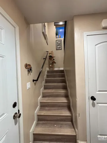 a view of staircase with white walls