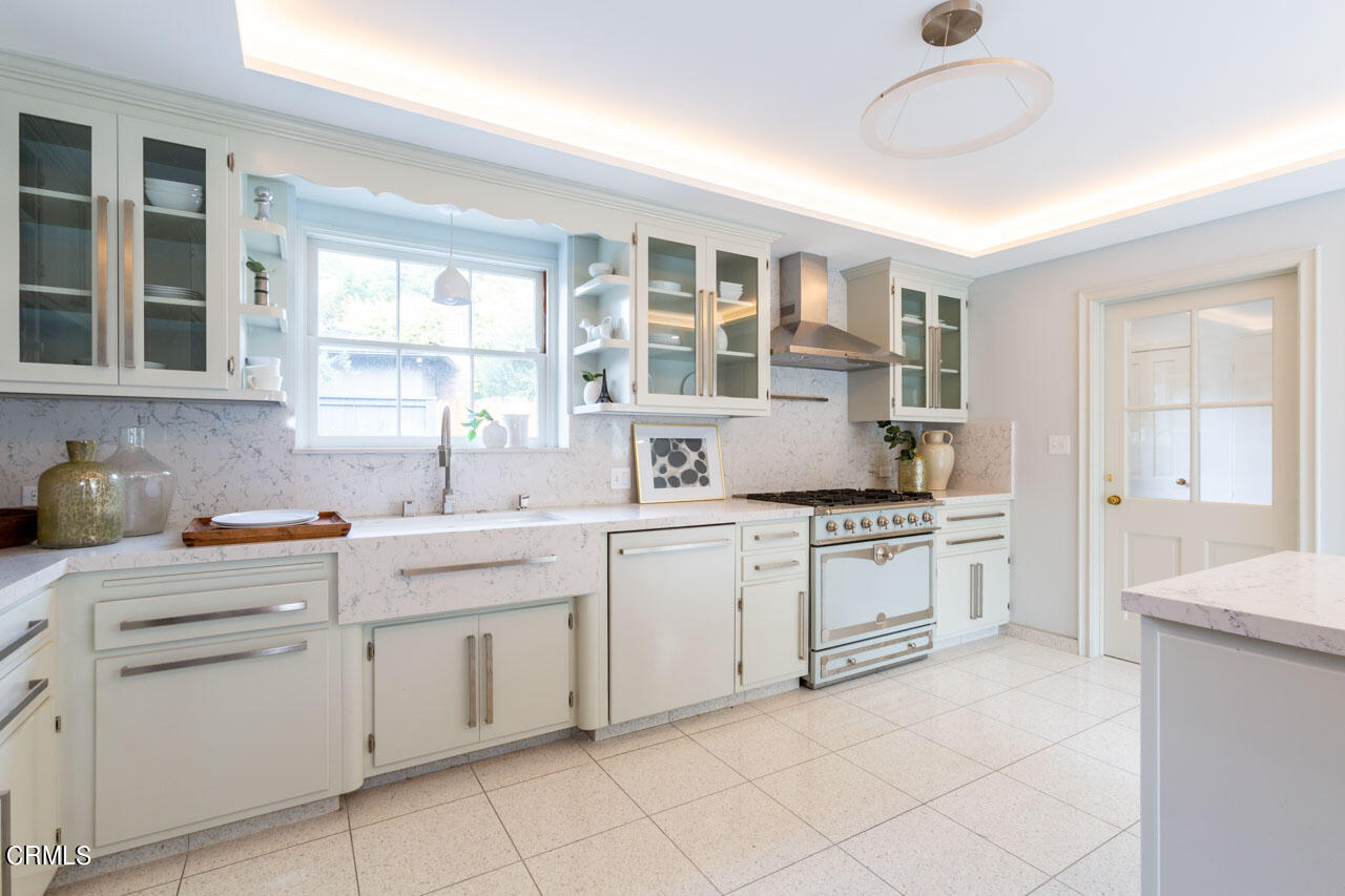 655 Elliott Drive Pasadena, CA 91106 - Photo 14 of 39 a kitchen with a sink cabinets and window