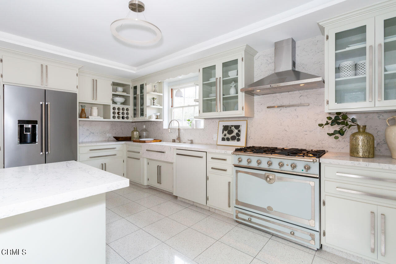 655 Elliott Drive Pasadena, CA 91106 - Photo 16 of 39 a kitchen with cabinets appliances and a window