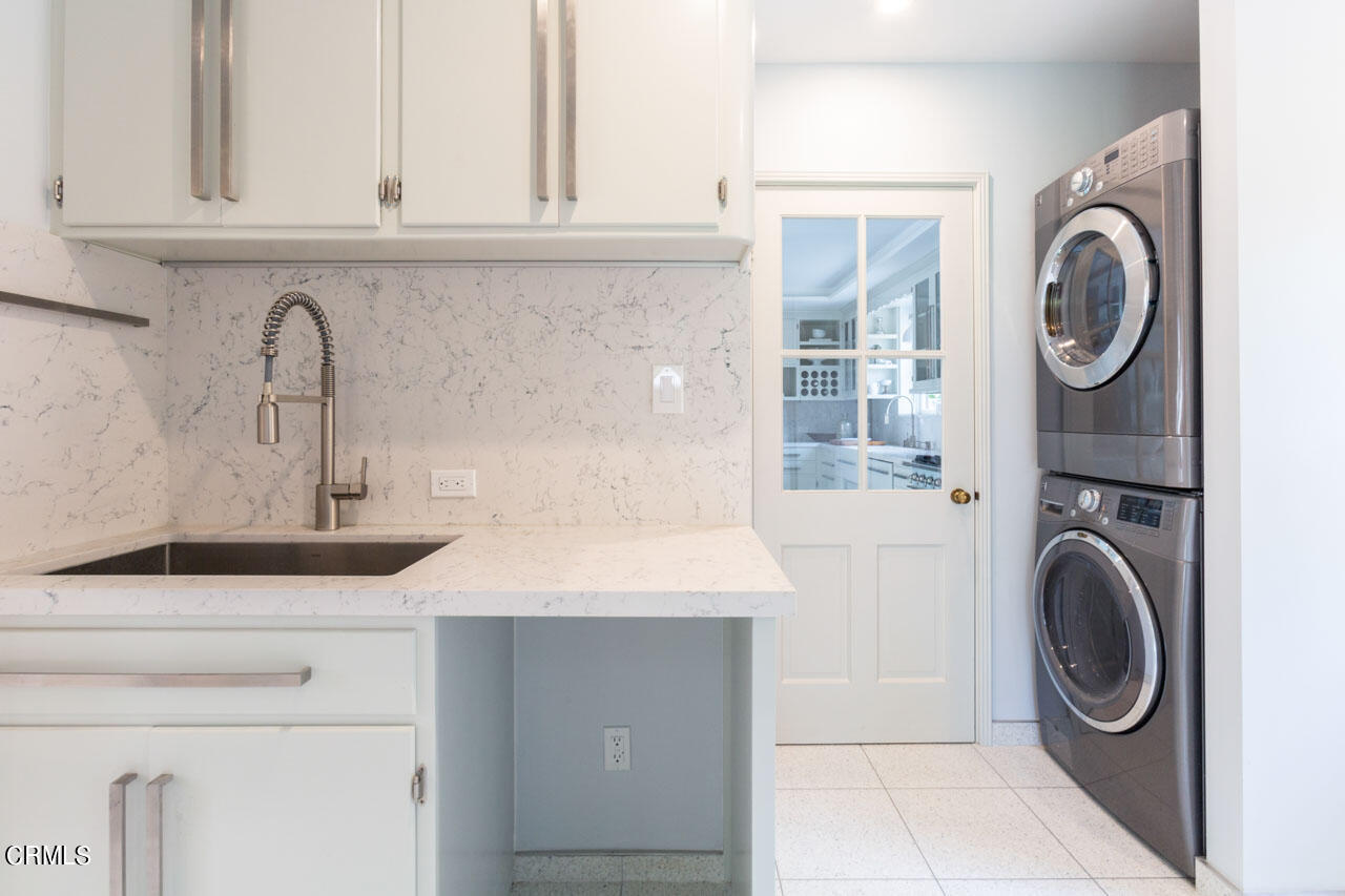 655 Elliott Drive Pasadena, CA 91106 - Photo 20 of 39 a close view of a utility room with dryer and washer