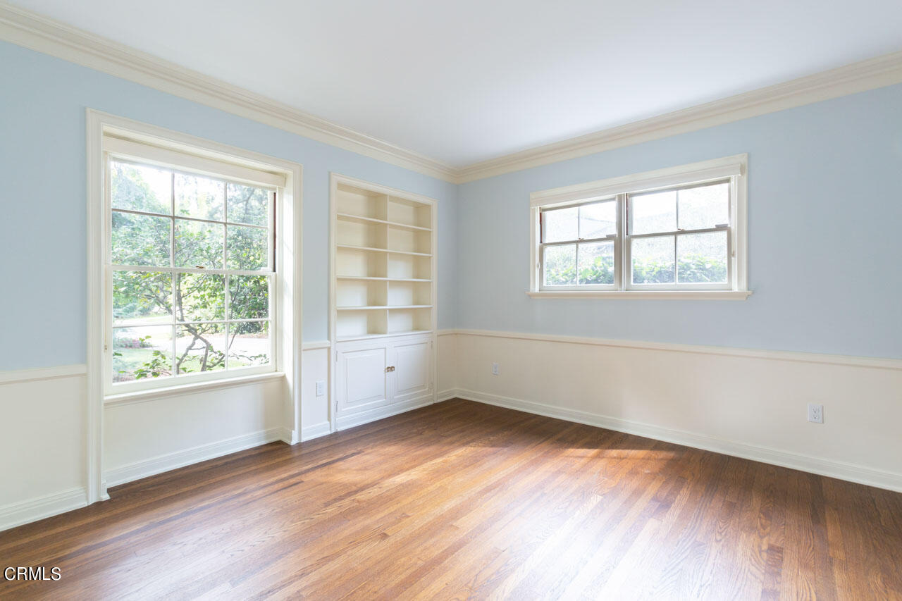 655 Elliott Drive Pasadena, CA 91106 - Photo 24 of 39 an empty room with wooden floor and windows