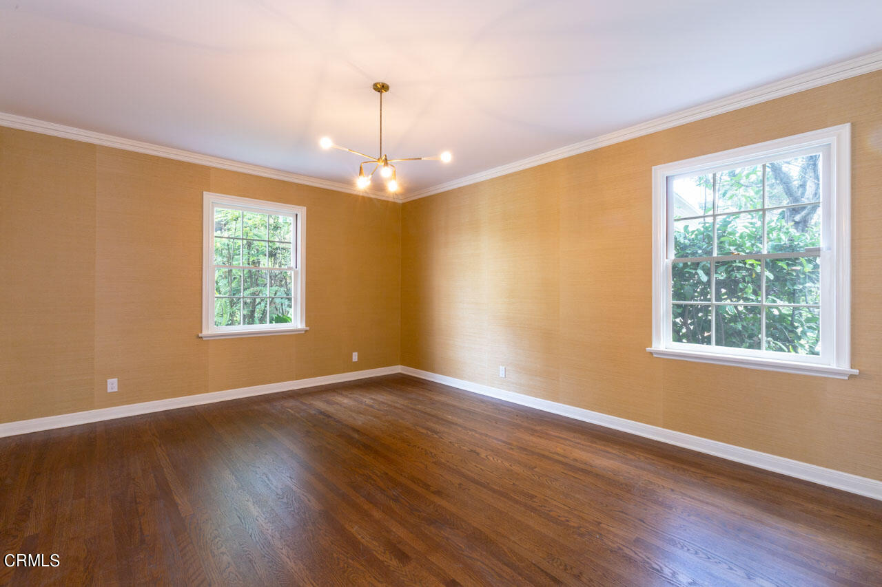 655 Elliott Drive Pasadena, CA 91106 - Photo 27 of 39 a view of an empty room with wooden floor and a window