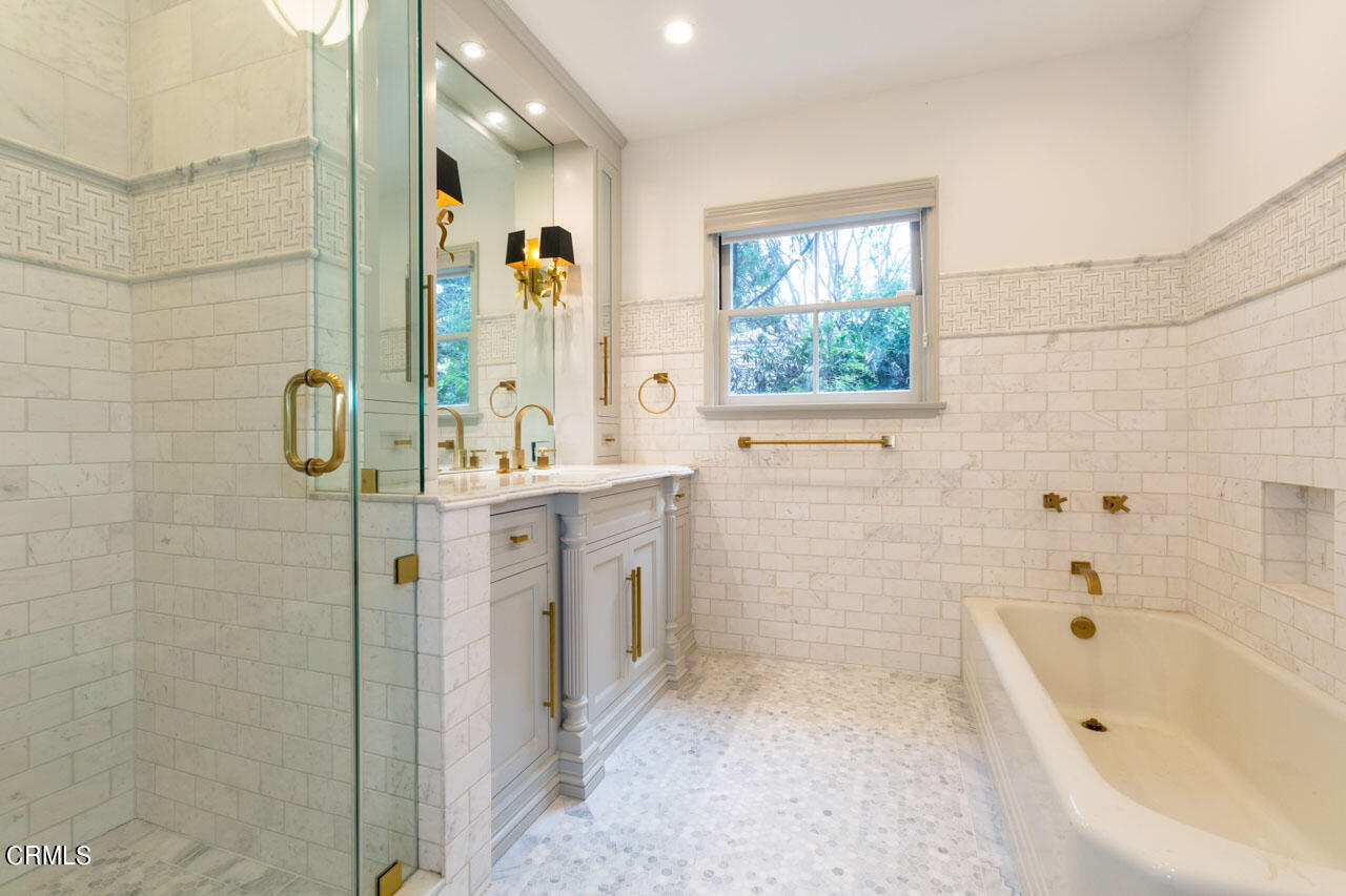 655 Elliott Drive Pasadena, CA 91106 - Photo 29 of 39 a bathroom with a tub sink and mirror