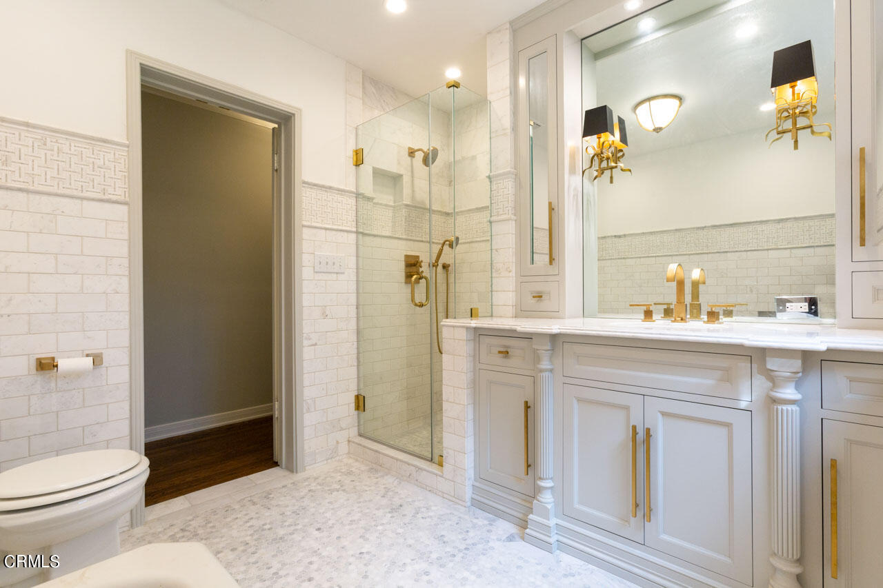 655 Elliott Drive Pasadena, CA 91106 - Photo 30 of 39 a bathroom with a sink a toilet and shower