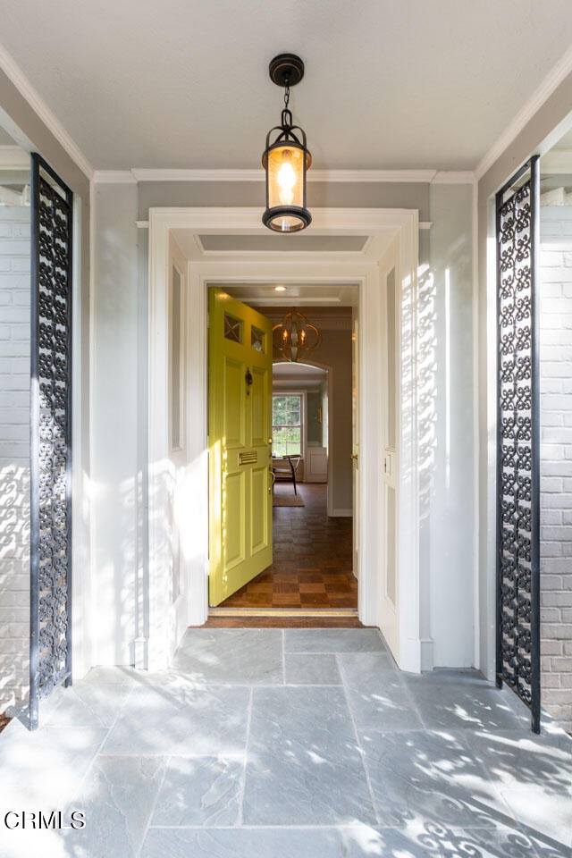 655 Elliott Drive Pasadena, CA 91106 - Photo 5 of 39 a view of a hallway with windows and chandelier