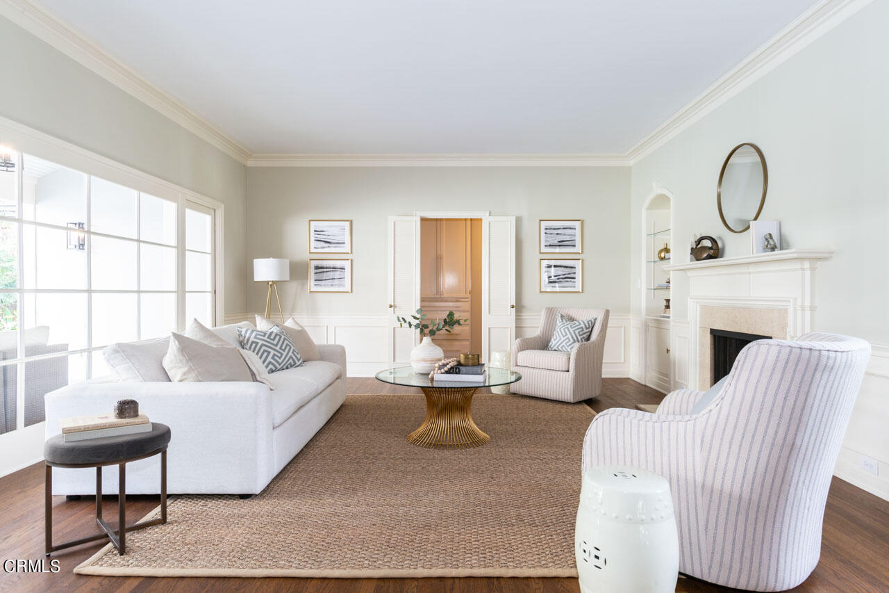 655 Elliott Drive Pasadena, CA 91106 - Photo 7 of 39 a living room with furniture a fireplace and a large window