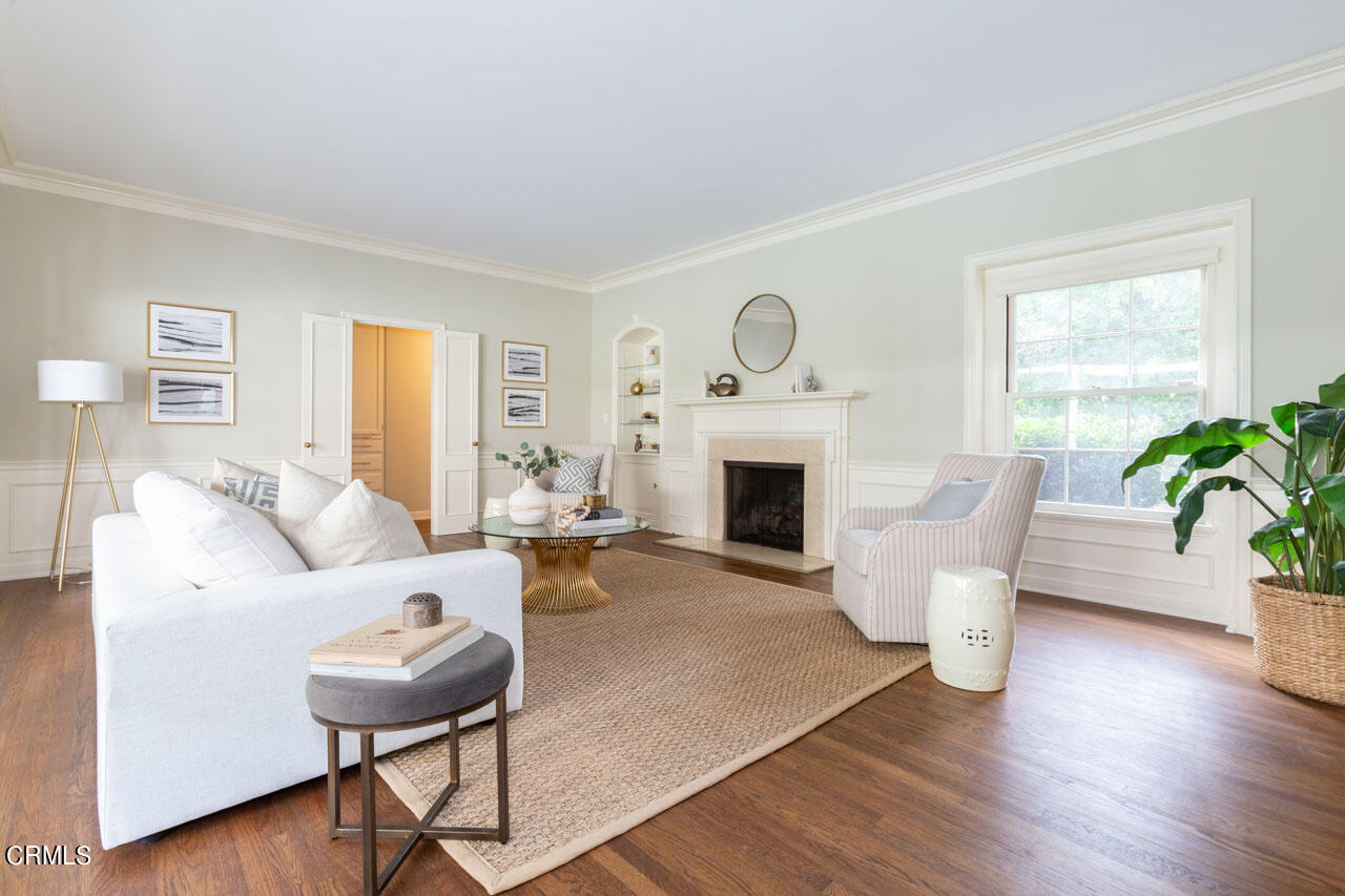 655 Elliott Drive Pasadena, CA 91106 - Photo 8 of 39 a living room with furniture a fireplace and a potted plant