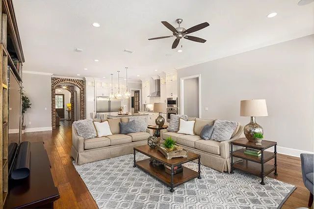 a kitchen with a table chairs refrigerator and stove