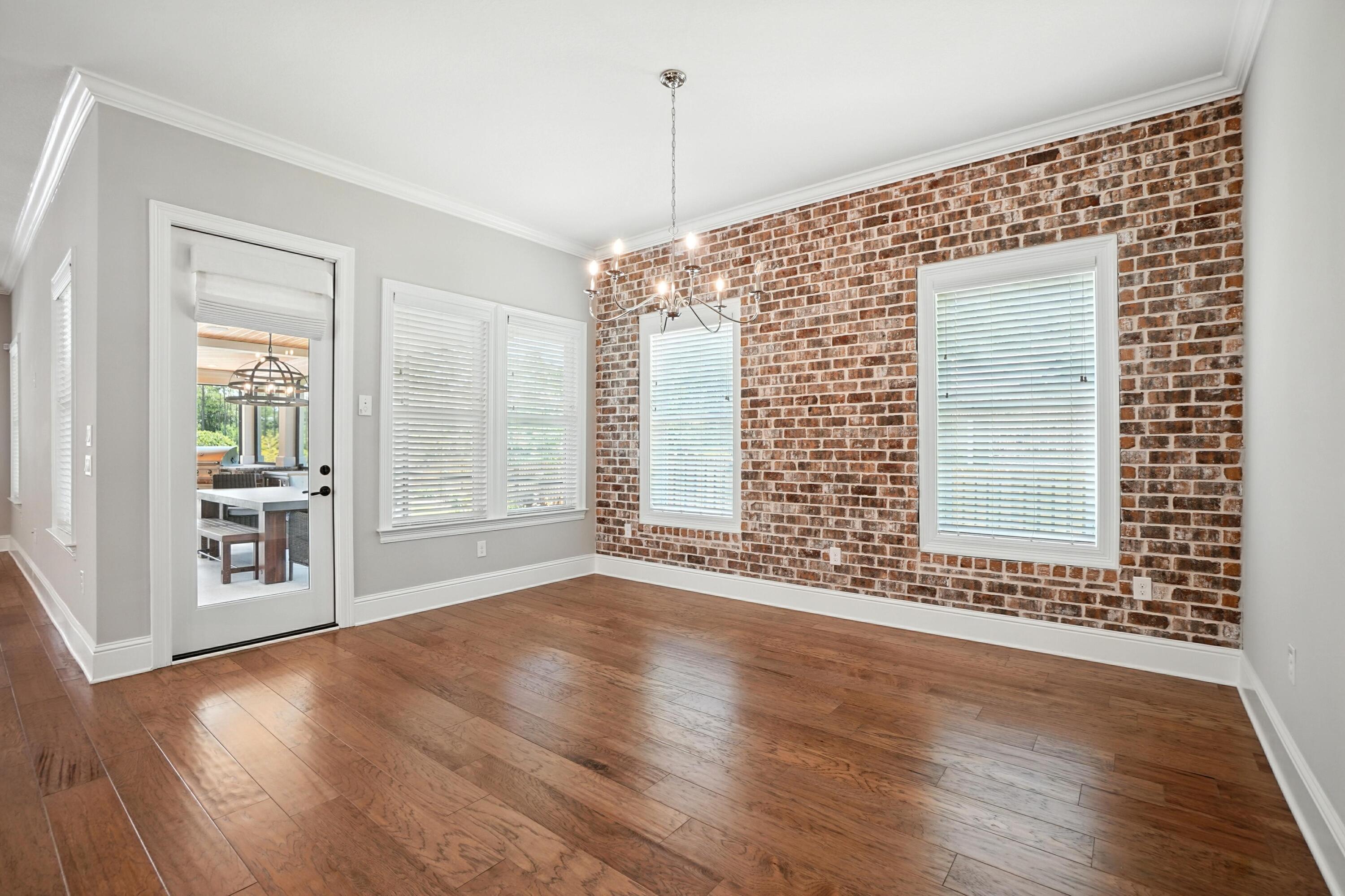 396 Revana Way Freeport, FL 32439 - Photo 21 of 68 an empty room with wooden floor and windows