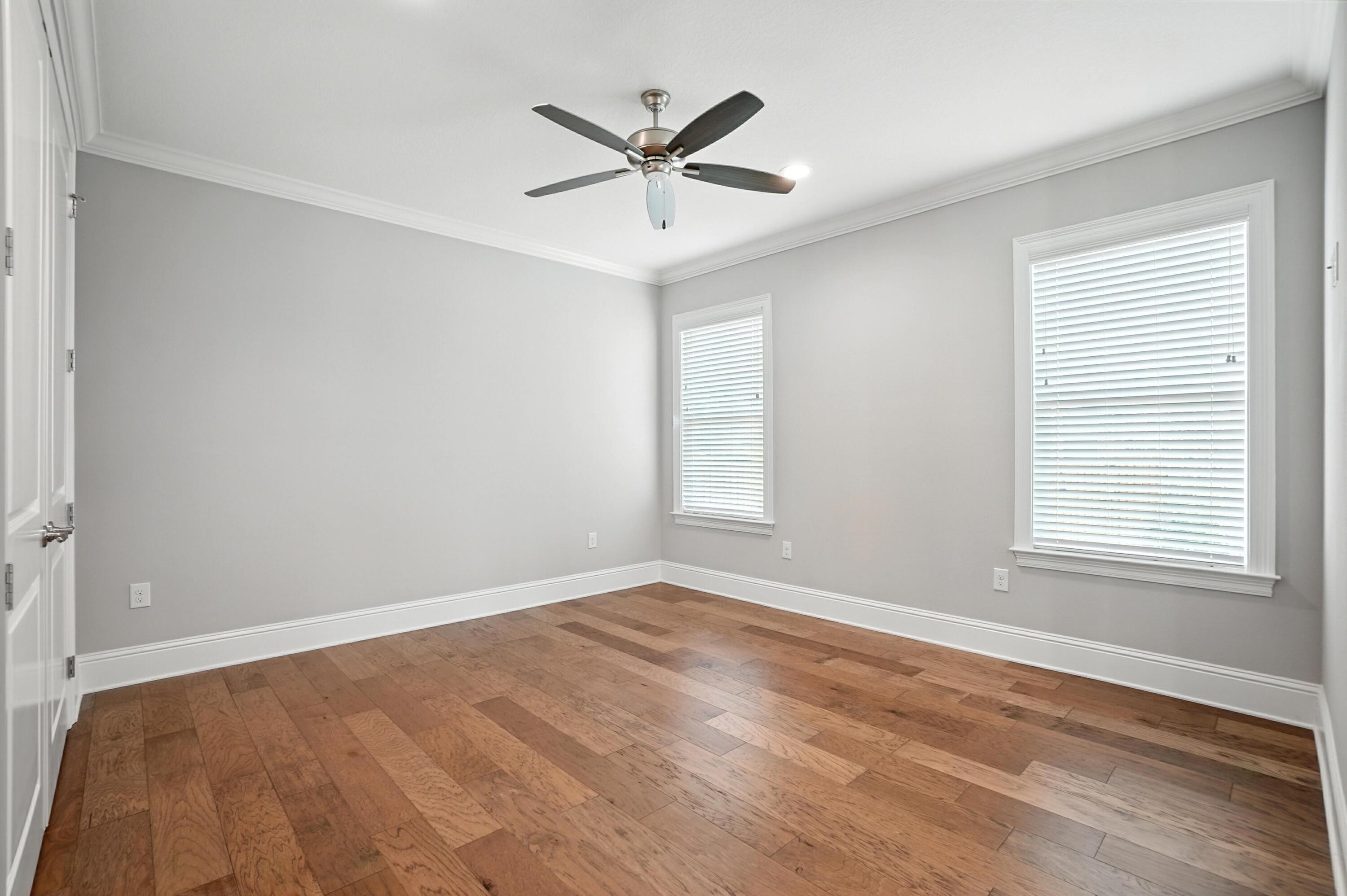 396 Revana Way Freeport, FL 32439 - Photo 23 of 68 an empty room with wooden floor and windows