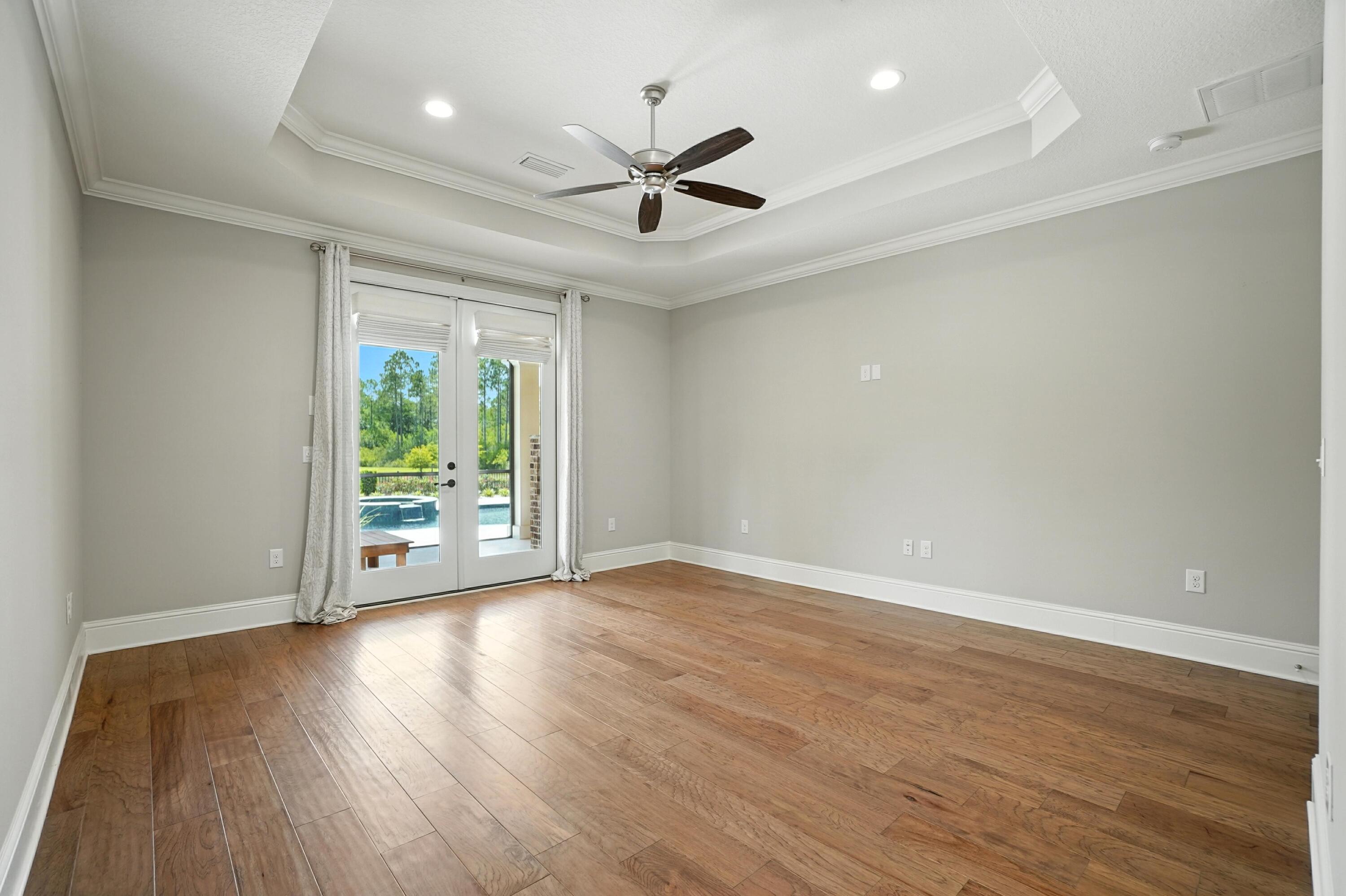 396 Revana Way Freeport, FL 32439 - Photo 29 of 68 an empty room with wooden floor fan and windows