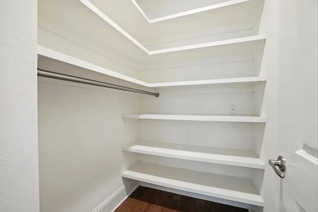 a bathroom with a shower a toilet and a shower