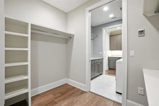 a view of a room with storage and utility room