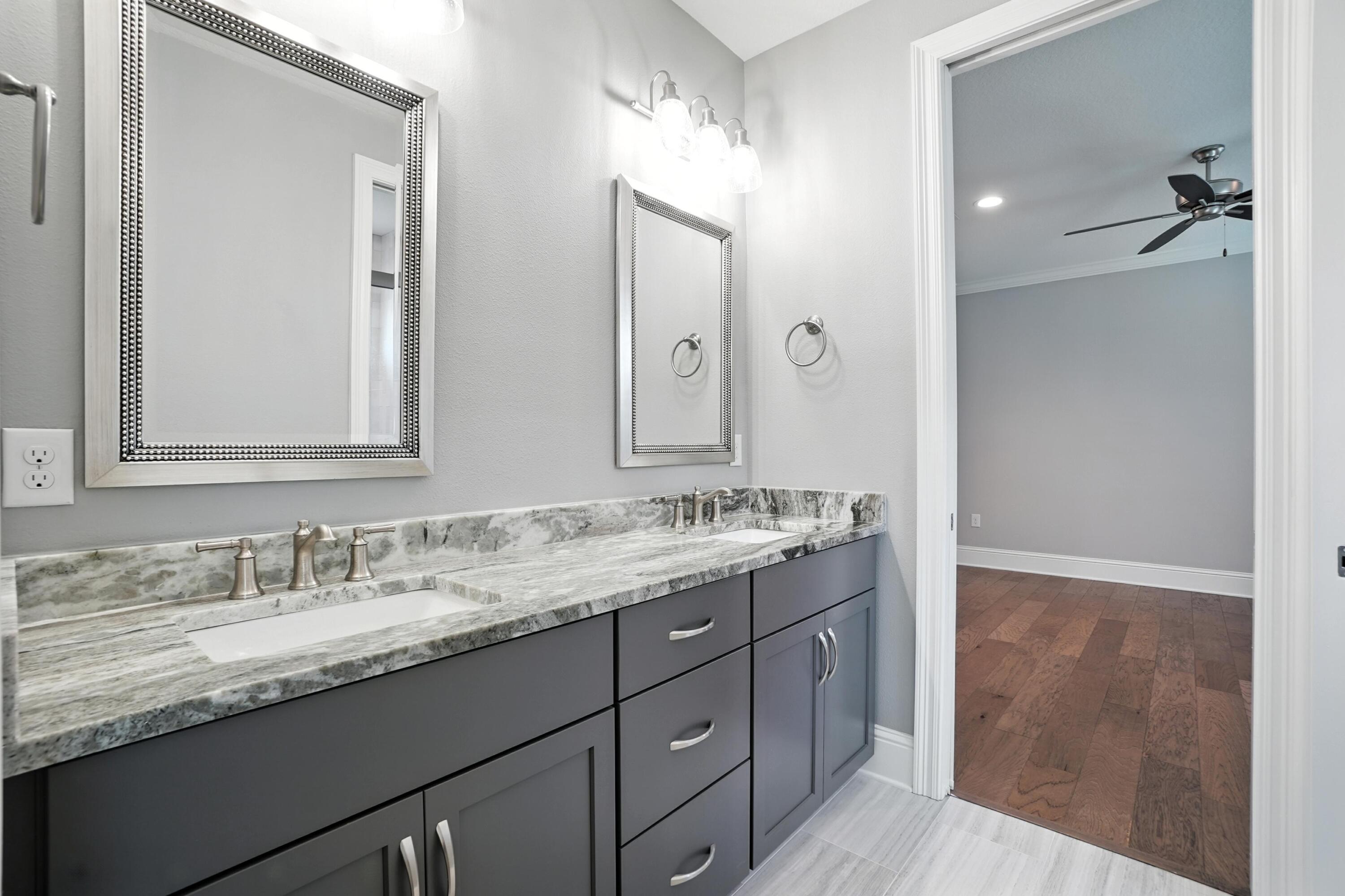 396 Revana Way Freeport, FL 32439 - Photo 36 of 68 a bathroom with a granite countertop sink double and mirror