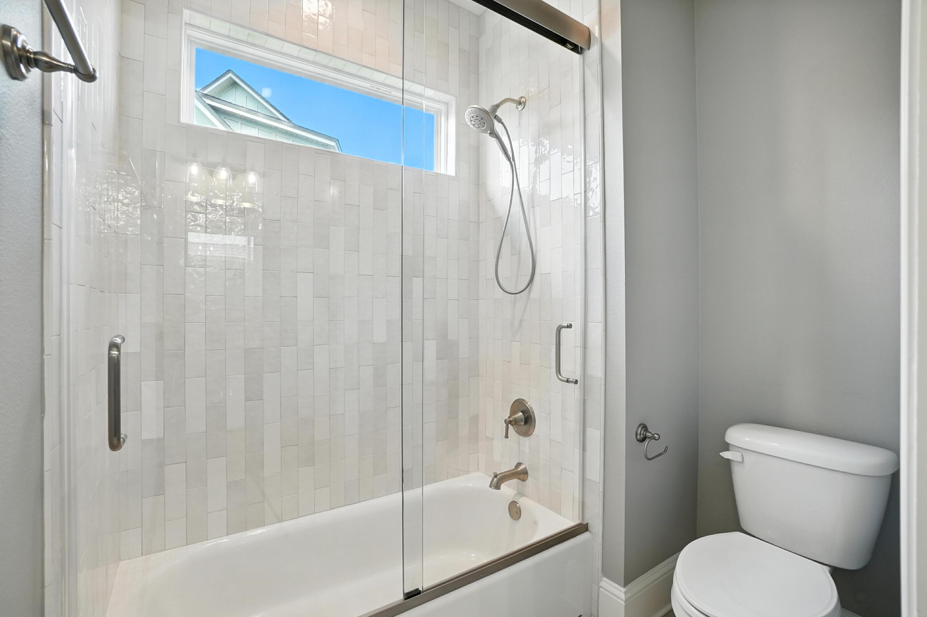 396 Revana Way Freeport, FL 32439 - Photo 37 of 68 a bathroom with a shower a toilet and a shower