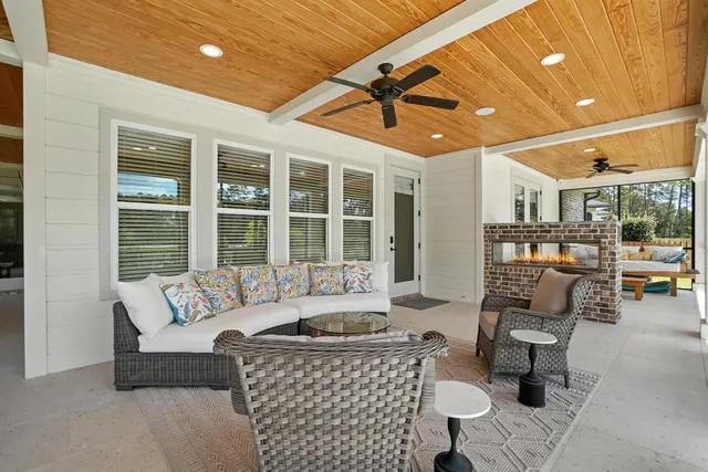 a view of a house with a backyard and a patio