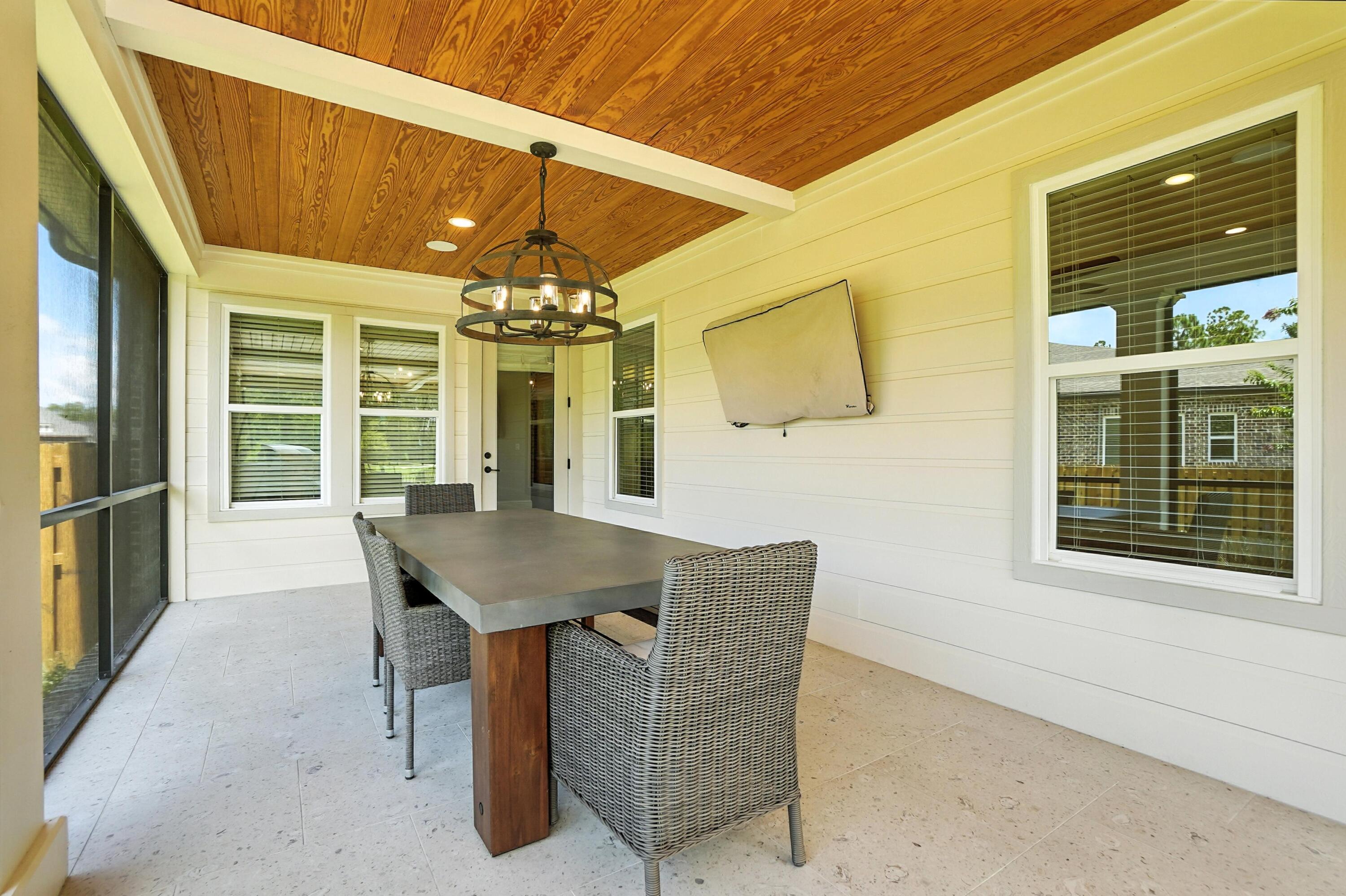396 Revana Way Freeport, FL 32439 - Photo 52 of 68 a view of a dining room with furniture and chandelier