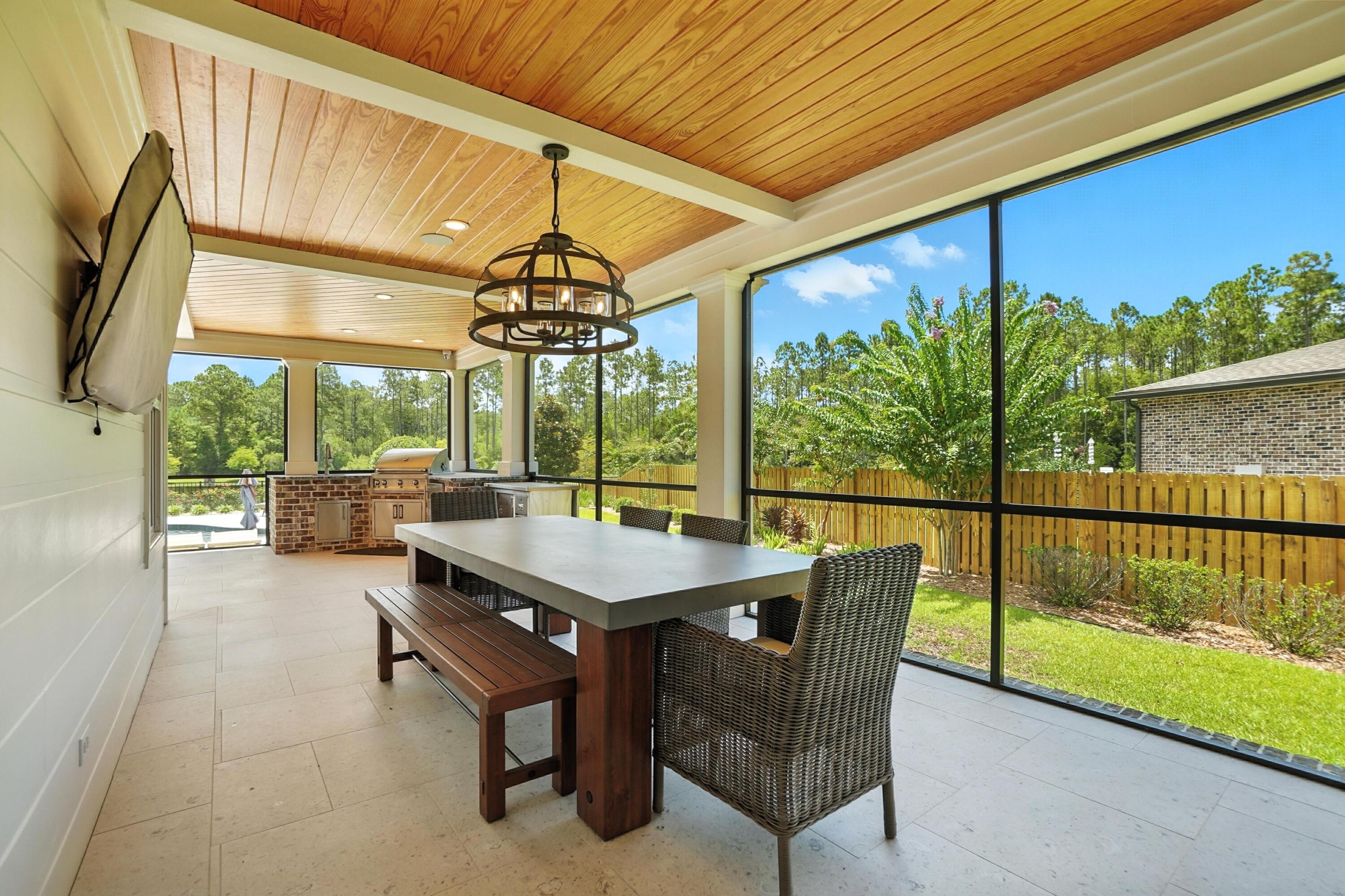 396 Revana Way Freeport, FL 32439 - Photo 53 of 68 a view of a patio with a table chairs and a patio