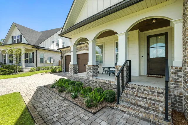 a view of livingroom and dining room with chandelier