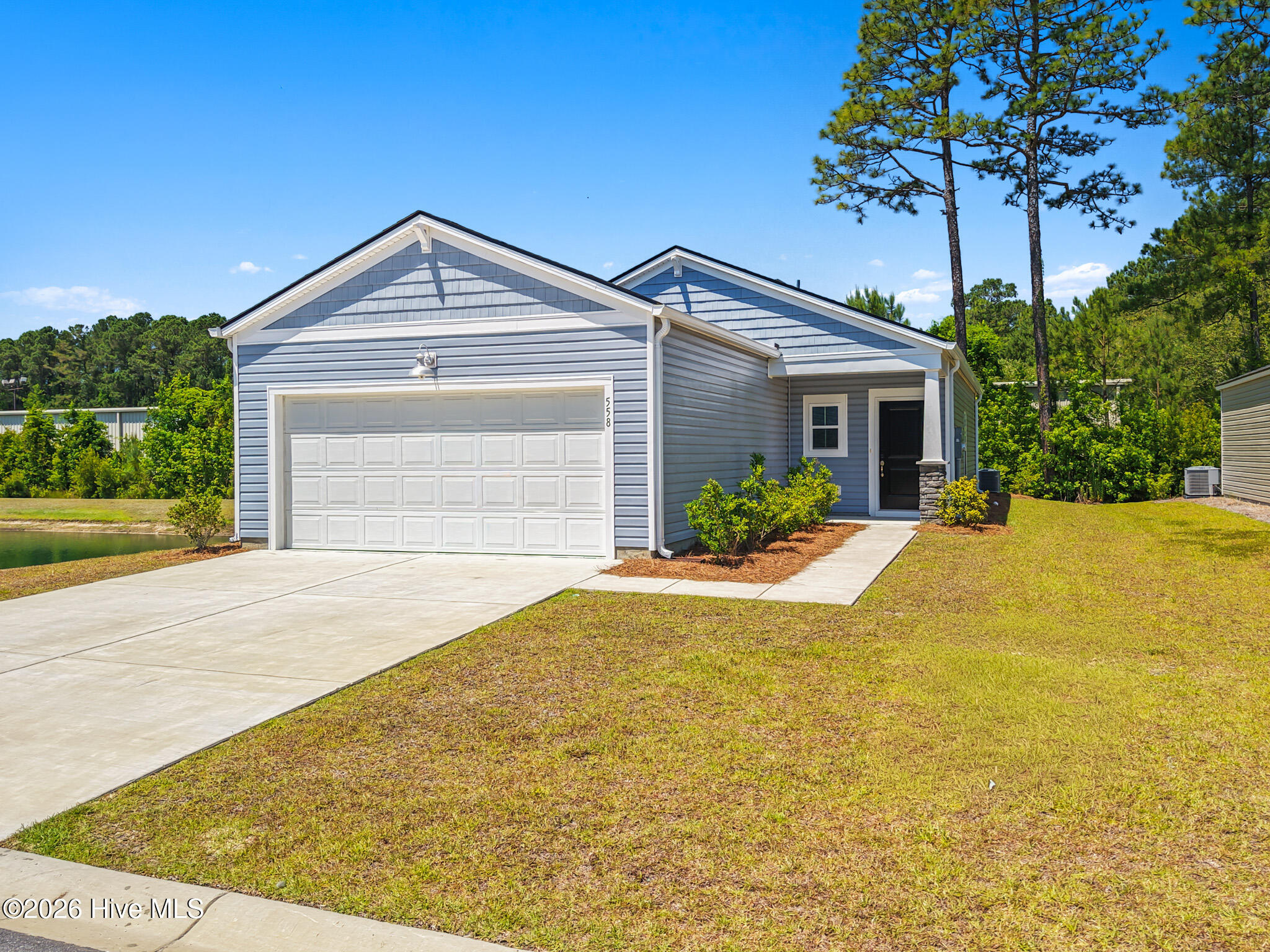 558 Ladyfish Loop Northwest Sunset Beach, NC 28468 - Photo 1 of 45 Corner lot next to the pond and backing up to the woods