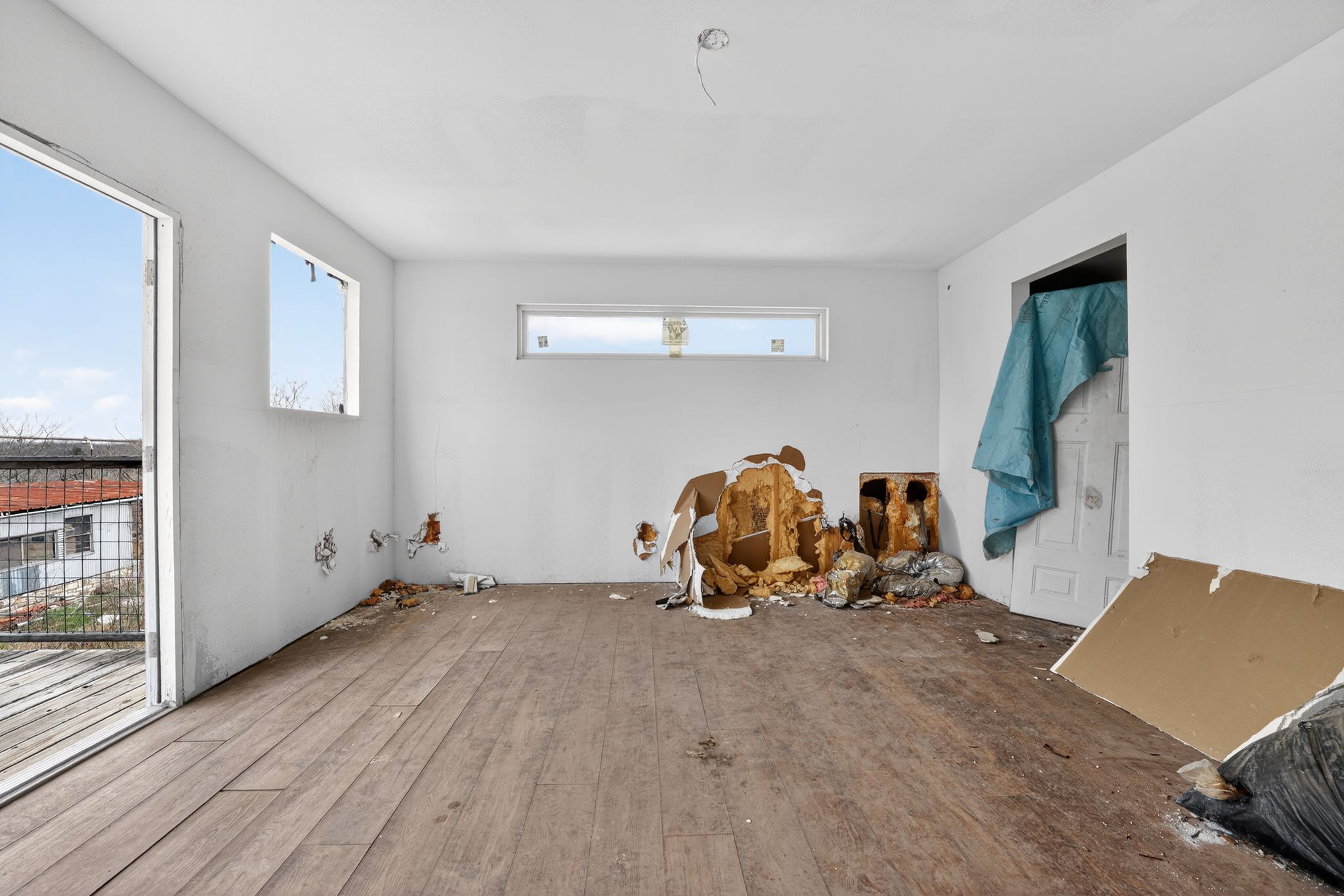 11223 Tom Sassman Road Austin, TX 78747 - Photo 36 of 40 Unfurnished room featuring wood-type flooring